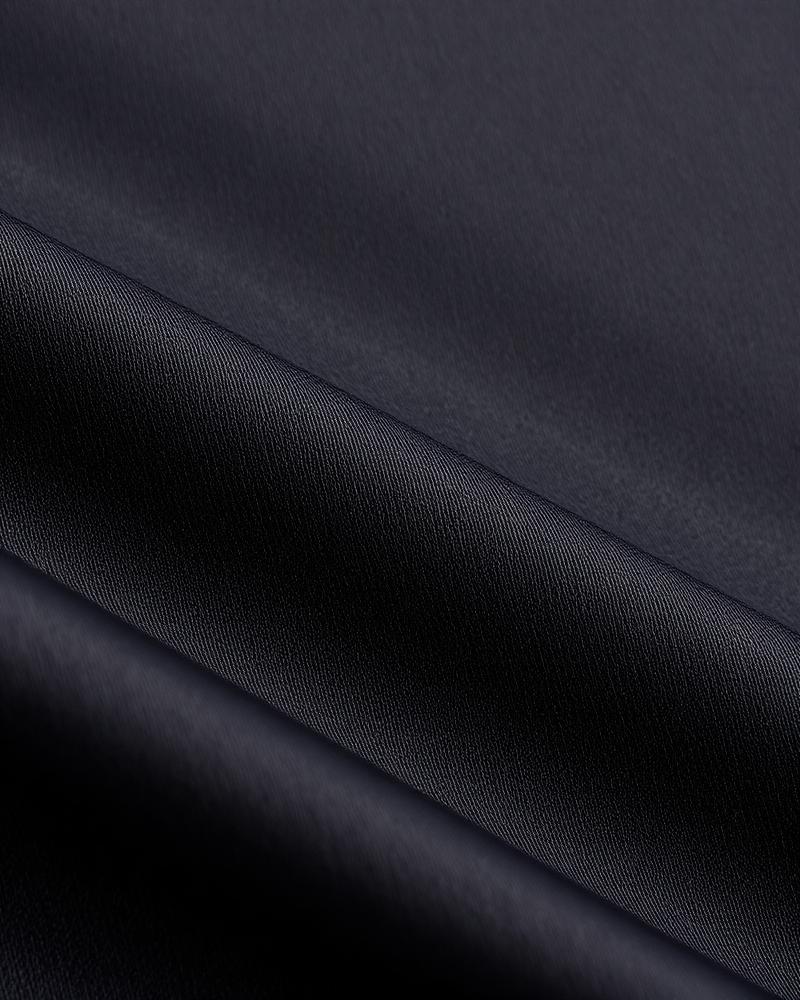Close-up charcoal grey sateen fabric texture