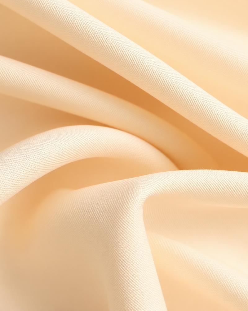 Close-up ivory sateen fabric texture