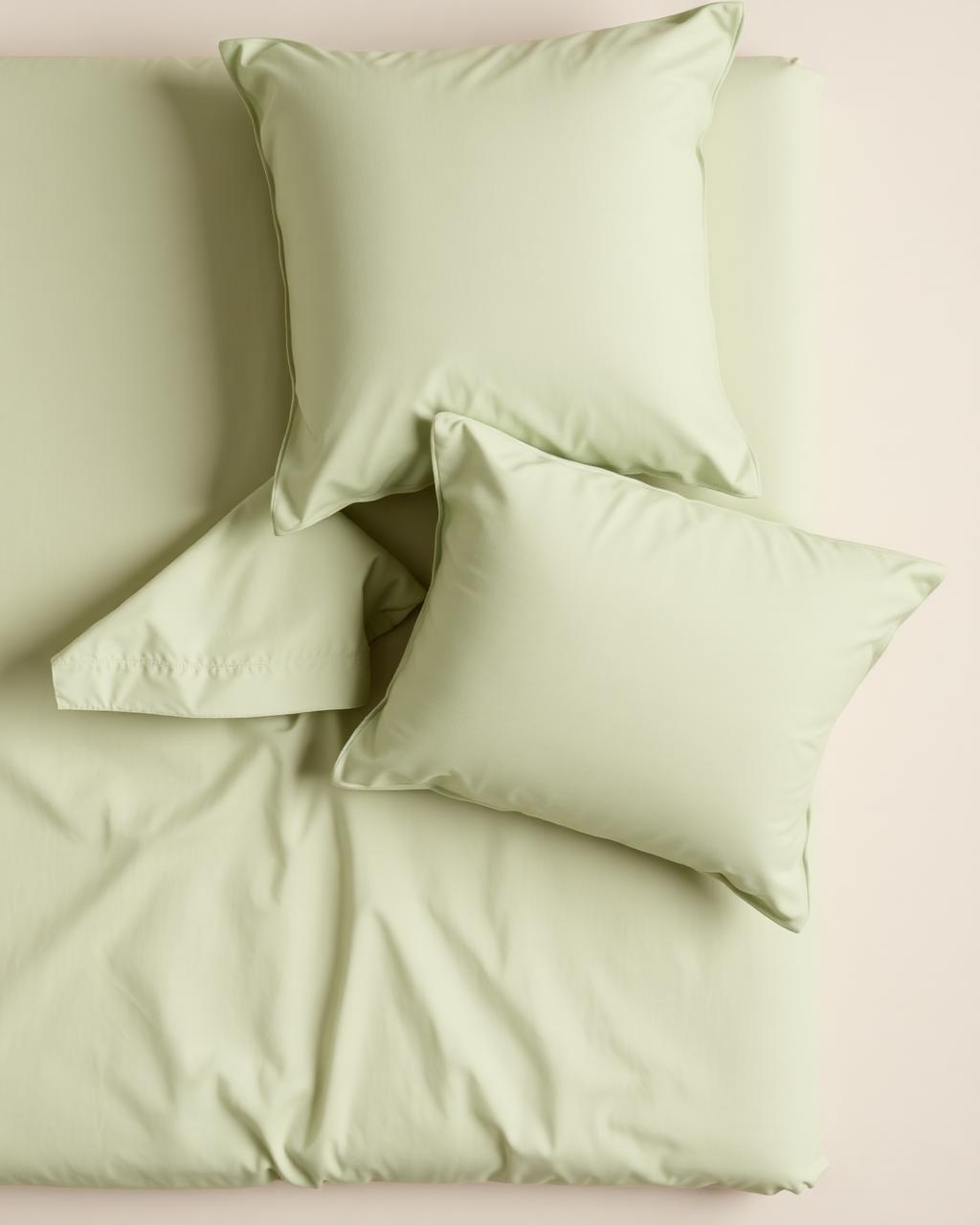 Percale sage pillowcase set flat lay