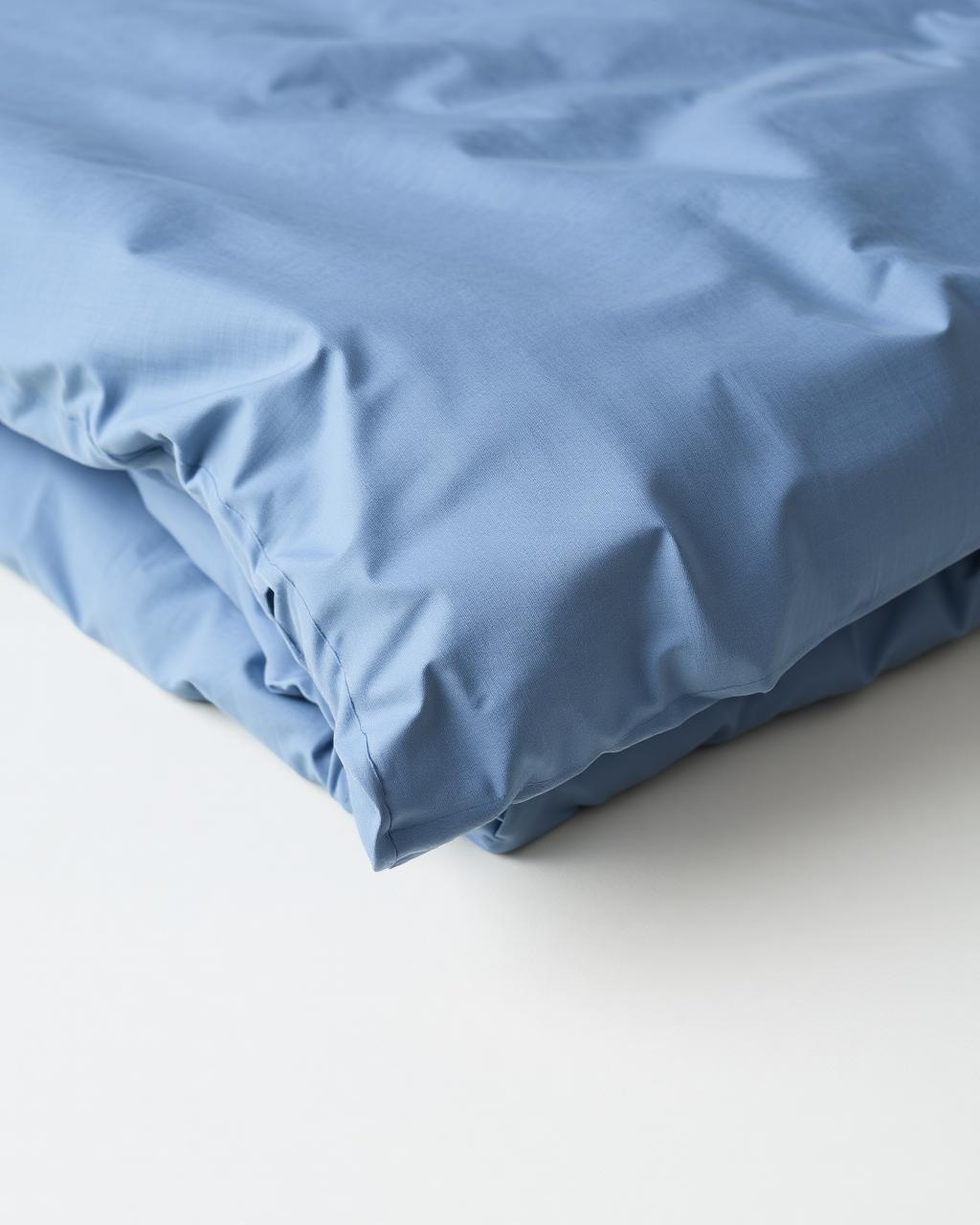 Folded percale slate blue duvet
